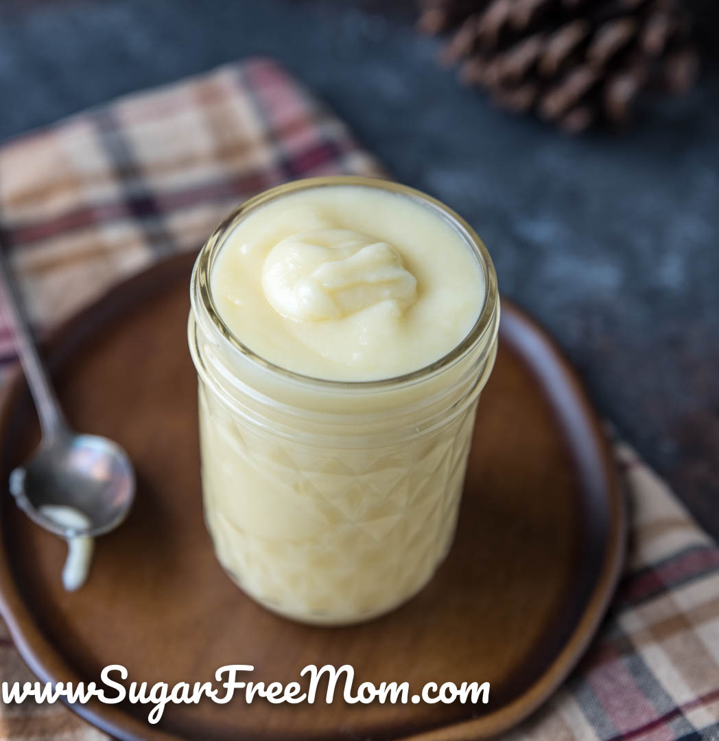 glass jar of condensed milk on a plate