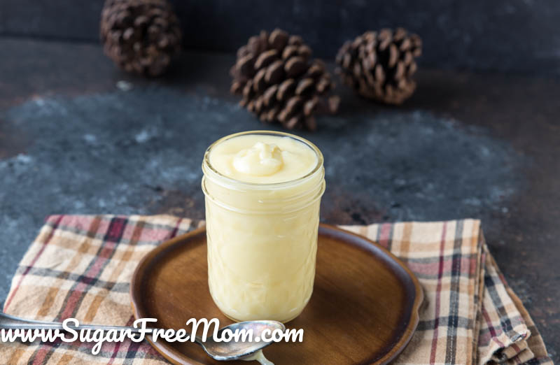 glass jar of condensed milk on a plate